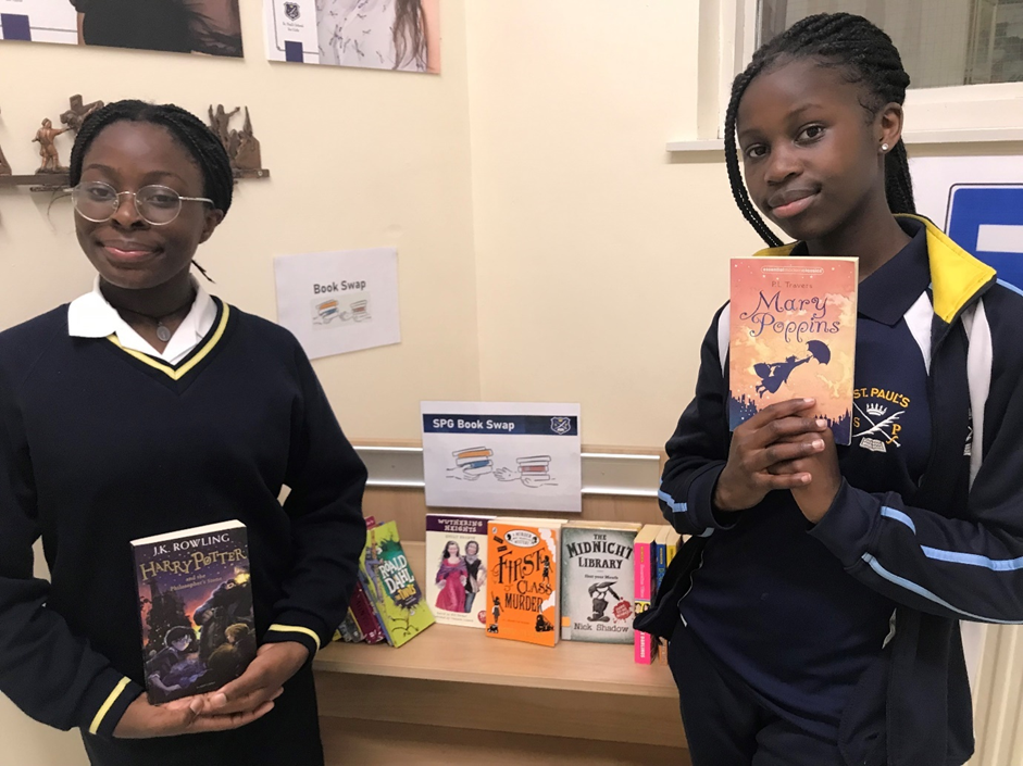 Pupils holding books