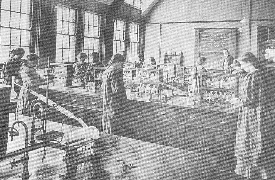Girls standing in laboratory